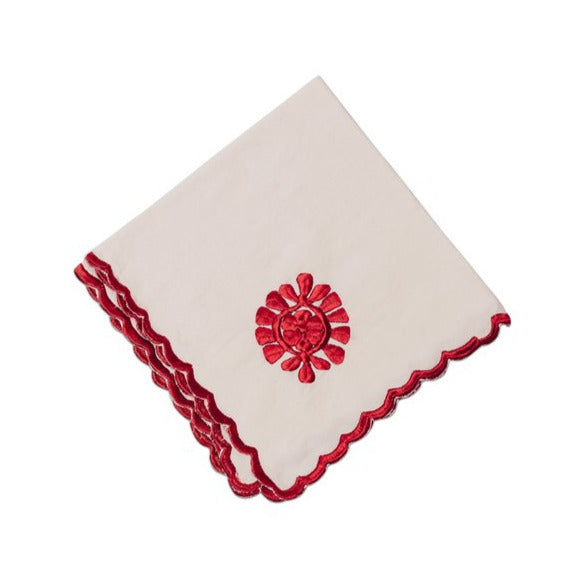 White napkin with red trim and floral design
